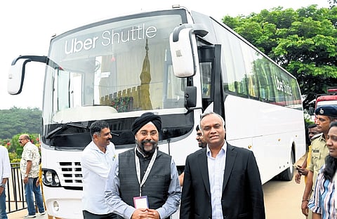 IT/BT Minister Priyank Kharge (right) and Uber India chief Prabhjeet Singh launch Uber Shuttle bus services in Bengaluru on Sunday
