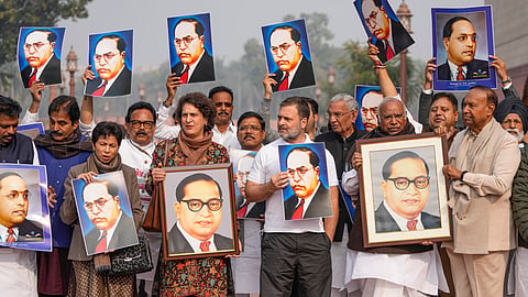 Several MPs of the INDIA bloc staged a protest in Parliament premises on Wednesday demanding Home Minister Amit Shah's apology for his remarks which they claimed were an insult to B R Ambedkar.