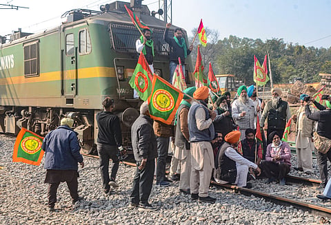 Farmers block railway tracks as part of their state-wide 'Rail Roko' protest to press the Centre into accepting their various demands, including a legally binding minimum support price for crops, in Patiala, Punjab, Wednesday, Dec. 18, 2024.