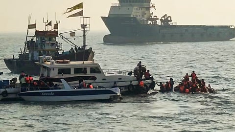 Passengers being rescued after a ferry capsized off Mumbai coast when a Navy craft crashed into it, Wednesday,
