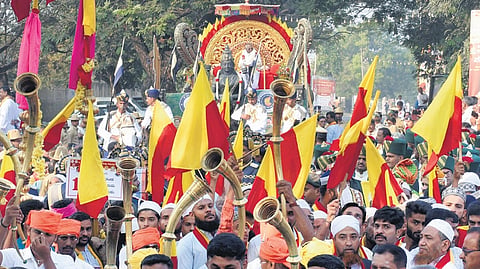 People take out a procession as part of the 87th Kannada Sahitya Sammelana in Mandya on Friday
