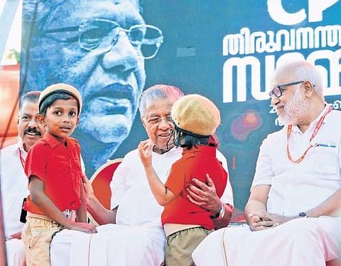Chief Minister Pinarayi Vijayan is all ears as two children who took part in the Red Volunteer march at the closing ceremony of the CPM district conference at Vizhinjam in Thiruvananthapuram on Monday. Politburo member M A Baby and state secretary M V Govindan are also seen
