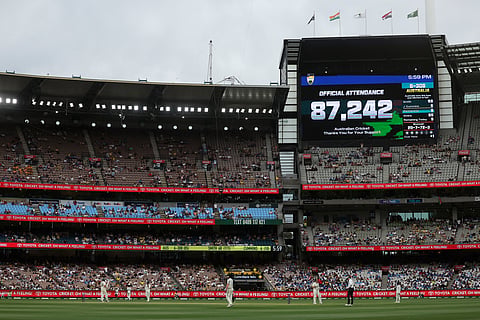 The official attendance figure is displayed on the scoreboard on the first day of the fourth cricket Test match between Australia and India at the Melbourne Cricket Ground (MCG) in Melbourne on December 26, 2024.