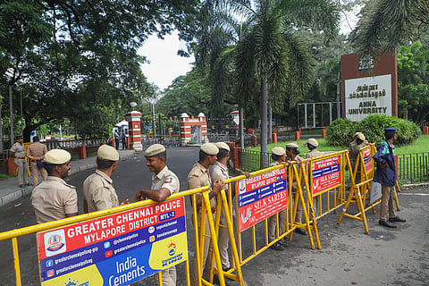 Police personnel stand guard outside the Anna University campus after the alleged sexual assault of its girl student, in Chennai, Thursday, Dec, 26. 2024.