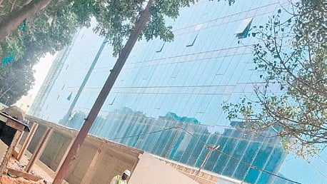 The compound wall built on the southern side of the Renaissance Prospero was partially demolished by the developer Gardencity Realty on Saturday