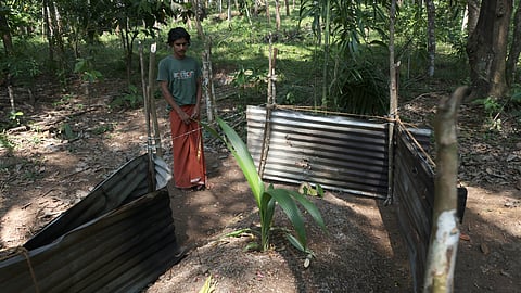 Induja's brother Shainu near the place where she was buried at Konnamoodu tribal settlement near Palode in Thiruvananthapuram.