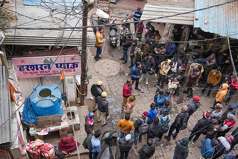 Media persons outside a hotel after five members of a family were found dead here, in Lucknow, Wednesday, Jan. 1, 2025.