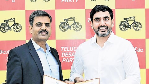TDP general secretary and HRD Minister Nara Lokesh exchange a copy of the MoU with representatives of insurance companies on Thursday