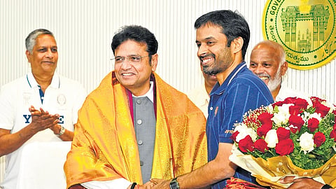 Badminton national chief coach Pullela Gopichand and IT and Industries Minister Sridhar Babu during a press meet at the secretariat in Hyderabad on Friday.