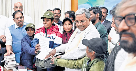CM Siddaramaiah interacts with the six Naxals who surrendered in his presence in Bengaluru on Wednesday.