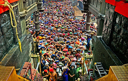 Pilgrims in jam jam-packed queue for darshan of Load Ayyappa in front of the Holy steps in Sabarimala on Friday