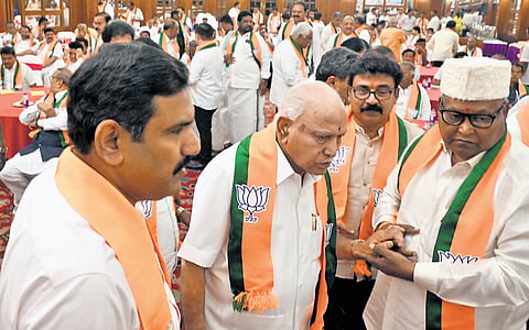 Former CM B S Yediyurappa, BJP state president B Y Vijayendra and other leaders arrive for the party meeting in Bengaluru on Friday | Nagaraja Gadekal