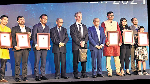 (From left) Arun Chandrasekhar, Mahmood Kooria, Shyam Gollakota, NR Narayana Murthy, Peter Sarnak, S Gopalakrishnan, Siddhesh S Kamat with their awards at the 16th edition of Infosys Science Awards on Saturday