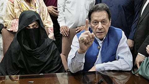 Pakistan’s former Prime Minister Imran Khan, right, and Bushra Bibi, his wife.