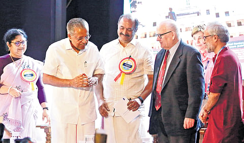 Chief Minister Pinarayi Vijayan talks to Philip G Altbatch on his way out after inaugurating the International Conclave on Next-gen Higher Education at Cusat on Tuesday. Also seen are Finance Minister K N Balagopal, Higher Education Minister R Bindu, Kerala State Higher Education Council vice-chairman Rajan Gurukkal and D R Nina Arnhold of World Bank