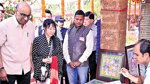 President Tharman and First Lady watch an artist at work in Raghurajpur village