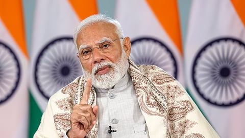 Prime Minister Narendra Modi speaks during distribution of property cards under Svamitva scheme, across 10 states and two Union Territories, via video conferencing.