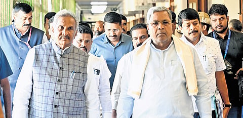 Chief Minister Siddaramaiah arrives for a meeting, along with Energy Minister
KJ George, at Vidhana Soudha on Monday