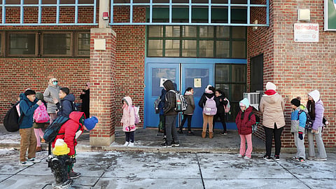 Students arrive for school Tuesday, Jan. 21, 2025, in the East Boston neighborhood of Boston.