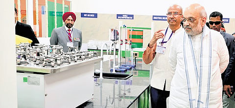 Amit Shah at Venkateshwara Cooperative soil and water testing lab in Nashik.