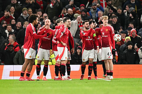 Manchester United's players celebrate their first goal following the own-goal scored by Rangers' English goalkeeper Jack Butland during the UEFA Europa league football match between Manchester United and Glasgow Rangers on January 23, 2025.