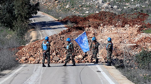 UN peacekeepers hold their flag in Blida, a Lebanese border village with Israel in south Lebanon, Saturday, Jan. 25, 2025.