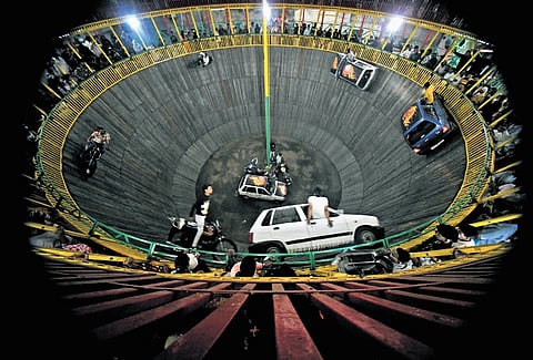 The wall of death carnival shows at Numaish exhibition in Hyderabad