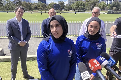 Afghan women cricketers Nahida Sapan, left, and Firooza Amiri speak to reporters at Junction Oval in Melbourne, Australia, Monday, Jan. 27, 2025.