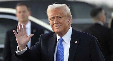 President Donald Trump waves after arriving on Air Force One at Palm Beach International Airport in West Palm Beach, Fla., Friday, Feb. 7, 2025.