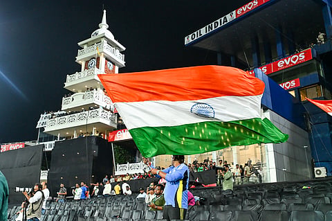 Crowd waving the India flag at the Barabati Stadium