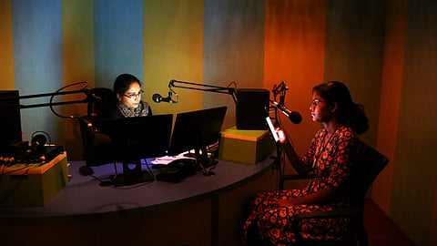 Tania Lewis and student volunteer Anuja hosting a programme