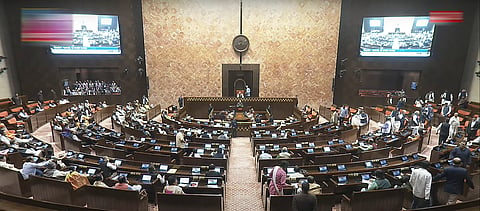 Opposition members walk out of the Rajya Sabha during the Budget session of Parliament, in New Delhi, Thursday, Feb. 13, 2025.
