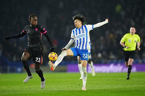 Brighton and Hove Albion's Kaoru Mitoma, center, controls the ball on his way to scoring against Chelsea during a Premier League match at the American Express Stadium, in Brighton, England, Friday, Feb. 14, 2025.