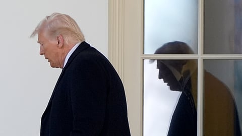 US President Donald Trump walks from the Oval Office to board Marine One as he departs from the South Lawn of the White House, Friday, Feb. 14, 2025, in Washington.