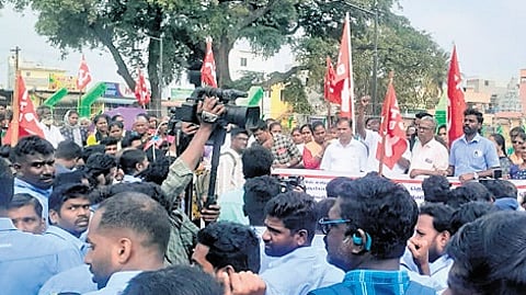 Workers protest with family members at Sunguvarchatram against the suspension of three Samsung India Workers Union members in February 2025.