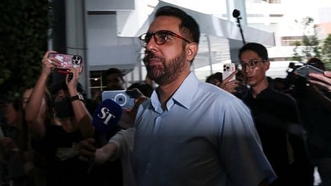 Singapore's Workers' Party Chief Pritam Singh walks outside the State Courts in Singapore.
