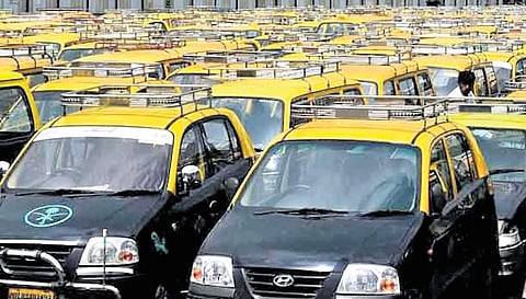 Delhi taxi owners protest as fitness tests halted over colour-coded stickers