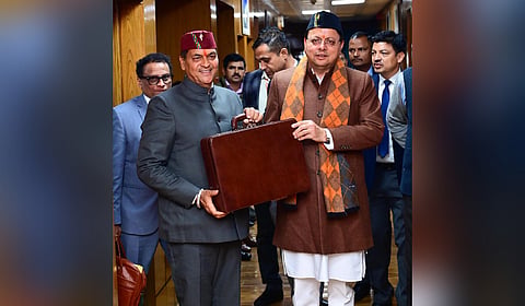 Uttarakhand Finance Minister Premchand Aggrawal (L) with CM Pushkar SIngh Dhami.