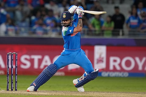 Virat Kohli plays a shot during the ICC Champions Trophy cricket match between India and Pakistan at Dubai International Cricket Stadium.