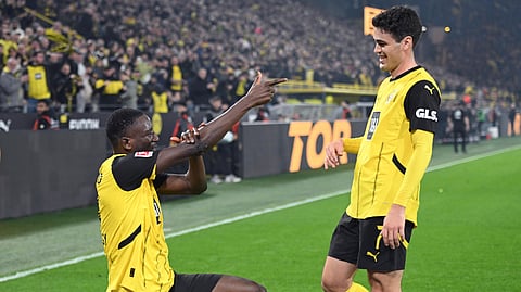 Dortmund's Serhou Guirassy, left, celebrates scoring with Giovanni Reyna during the Bundesliga soccer match between Borussia Dortmund and FC Union Berlin at Signal Iduna Park, Dortmund, Germany, Saturday Feb. 22, 2025.