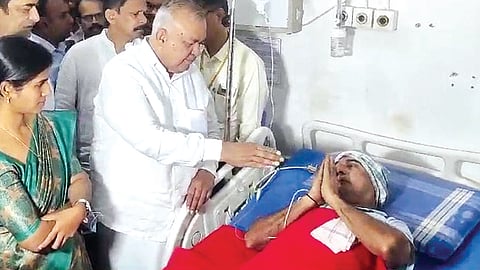 Transport Minister Ramalinga Reddy meets injured bus conductor Mahadevappa Hukkeri at BIMS Hospital in Belagavi