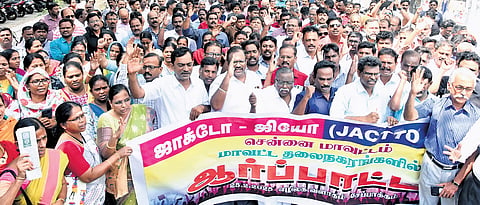 Government school teachers and employees staging a demonstration demanding the reinstatement of the old pension scheme at the Ezhilagam in Chepauk, Chennai on Tuesday