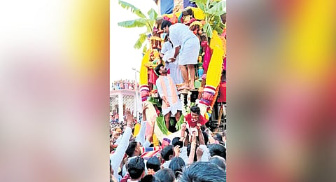 Infant tossing ritual under way in a Koppal village