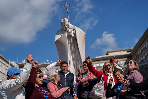 Vatican says Pope Francis continues to improve but his prognosis remains guarded