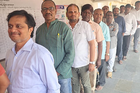 Voters wait in line at the Karimanagar Graduates Constituency during Telangana Legislative Council elections.