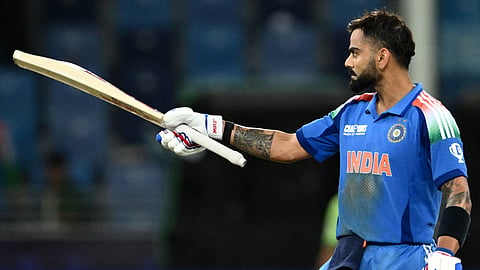 India's Virat Kohli celebrates after scoring a century and his team's win at the end of the ICC Champions Trophy ODI cricket match between Pakistan and India at the Dubai International Stadium in Dubai on February 23, 2025.
