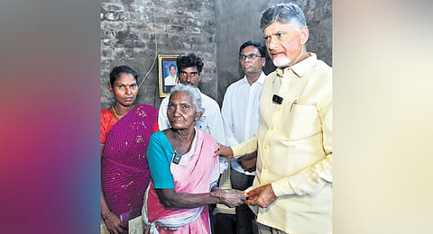 CM Chandrababu Naidu hands over pension to a woman at Ramanaidupalli in Chittoor district on Saturday