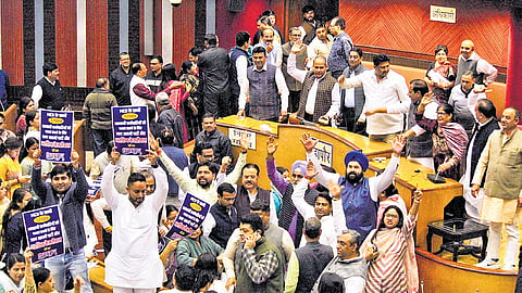 AAP and BJP councillors protest during a meeting of MCD