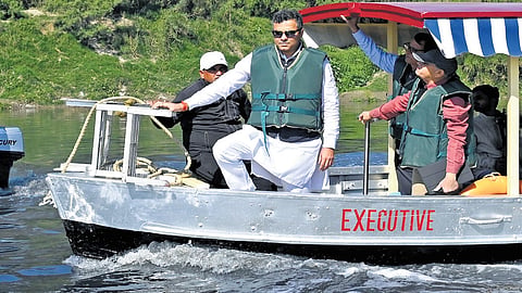 Delhi Minister Parvesh Sahib Singh Verma takes a boat ride during inspection of the cleanliness efforts at Yamuna ghats, in New Delhi on Wednesday, March 5, 2025.