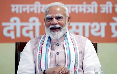 Prime Minister Narendra Modi interacts with 'Lakhpati Didis', in Navsari, Gujarat.